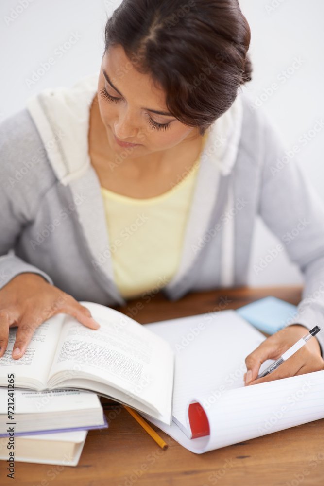 Reading, woman writing and student studying in college, learning and work on school project at desk. Books, serious person at table and education, knowledge and info for test on notepad in university Reading, woman writing and student studying in college, learning and work on school project at desk. Books, serious person at table and education, knowledge and info for test on notepad in university