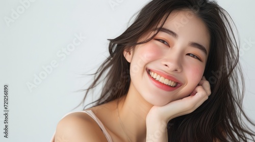 Close-up portrait of yong woman casual portrait in positive view, big smile, beautiful model posing in studio over white background.