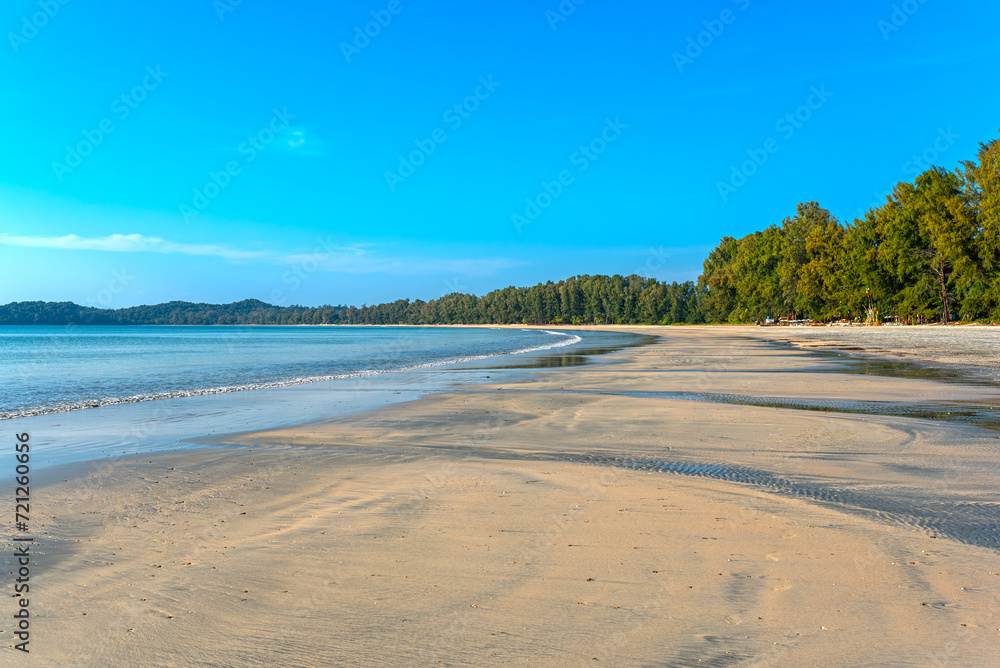 The dreamlike beach named Ao Yai on the island of Ko Phayam. Ao Yai is the largest bay on the west coast, about 3 km long. There are several tourist resorts under the trees on the beach