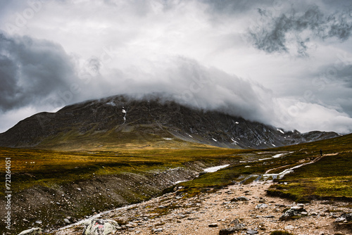 Beautiful dark mountain in Norway in the clouds.