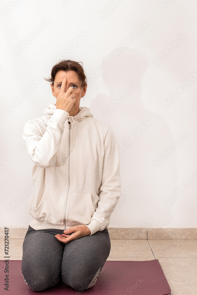 German woman practicing yoga indoors. Healthy lifestyle and relaxation concept. German woman practicing yoga indoors. Healthy lifestyle and relaxation concept.