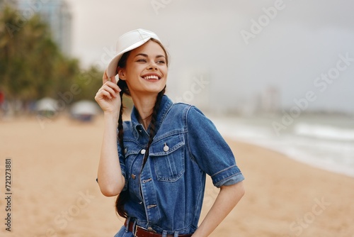 Beautiful Summer Lady: A Attractive Young Woman in a Stylish Hat Enjoying a Relaxing Vacation on a Sunny Beach © SHOTPRIME STUDIO