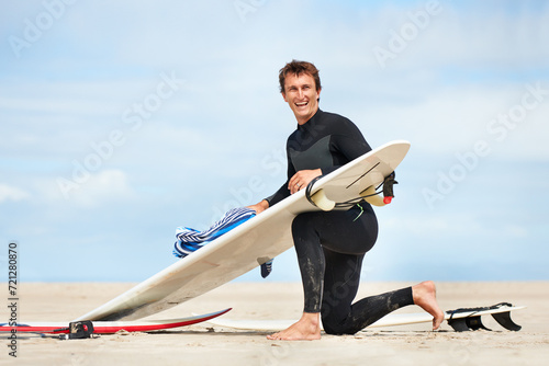 Photography Surfer, man and portrait with surfboard on beach with wetsuit, blue sky and cleaning with mock up space