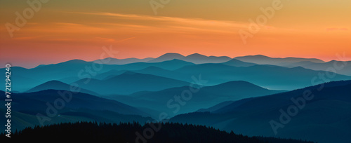Sunrise overr autumn mountain panorama. Scenic fall landscape. Wide-angle view capturing the beauty of mountains in the autumn season, perfect for evoking the tranquility and colors of fall.