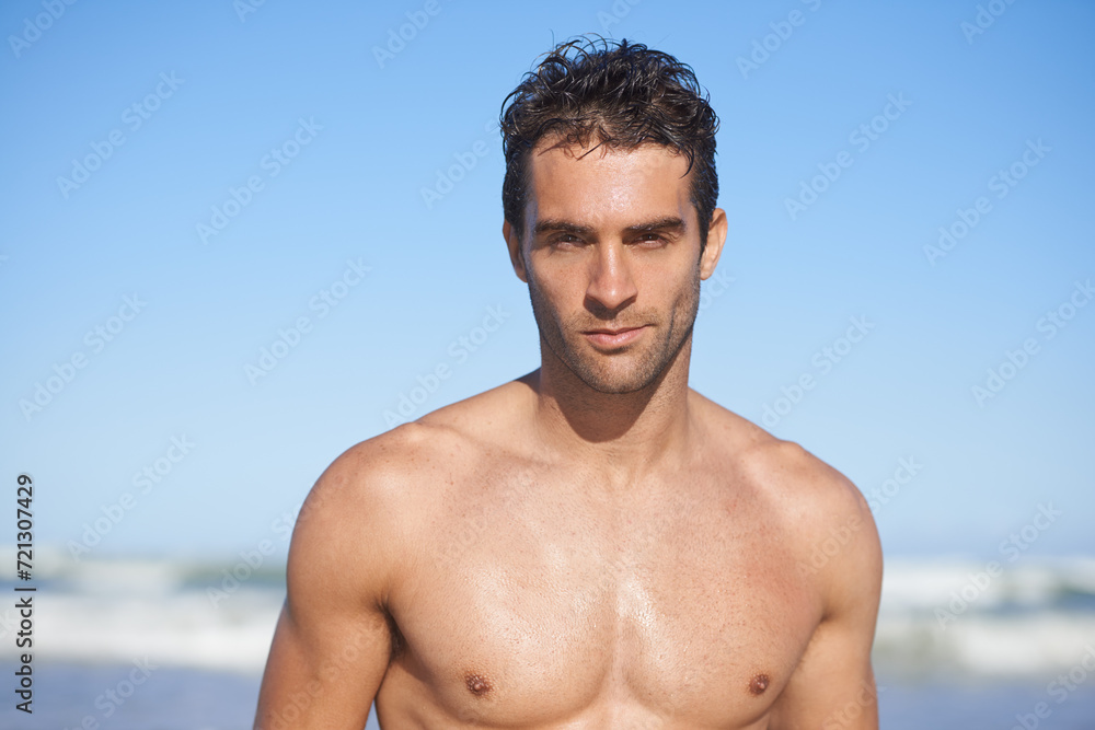 Man, portrait and beach for swimming, workout or outdoor exercise by the ocean coast in summer. Face of muscular male person or professional swimmer for on holiday weekend or vacation by the sea Man, portrait and beach for swimming, workout or outdoor exercise by the ocean coast in summer. Face of muscular male person or professional swimmer for on holiday weekend or vacation by the sea