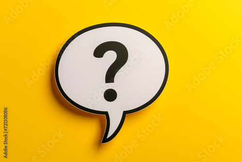 Question mark speech bubble isolated on yellow background. photo