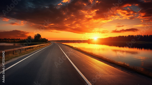 Asphalt road along the lake at sunset. Beautiful summer landscape . © Art AI Gallery