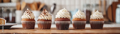Rustic kitchen scene with homemade cupcakes, including vanilla, chocolate, and carrot cake varieties, on a wooden countertop