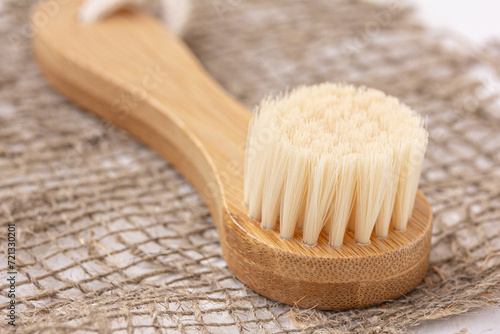 Close up of wooden facial brush. Bathroom accessories. Beauty, sustainable and wellness concept