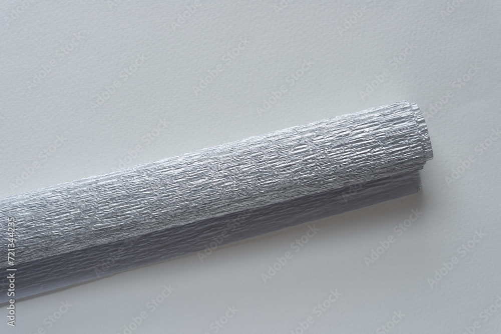 Fototapeta premium rolled crepe paper isolated on blank paper