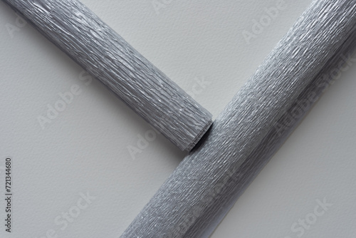 two metallic silver crepe paper rolls photo
