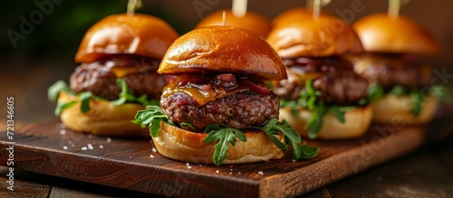 Delicious Homemade Mini Beef Burgers Served on a Charming Miniature Board: Homemade, Mini, and Beef Burgers Perfectly Presented on a Serving Board photo