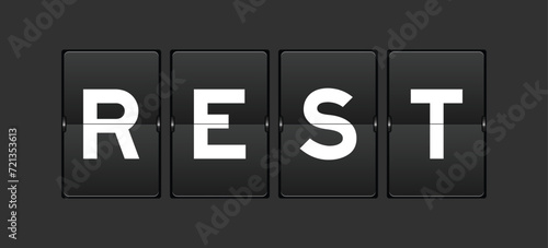 Black color analog flip board with word rest on gray background
