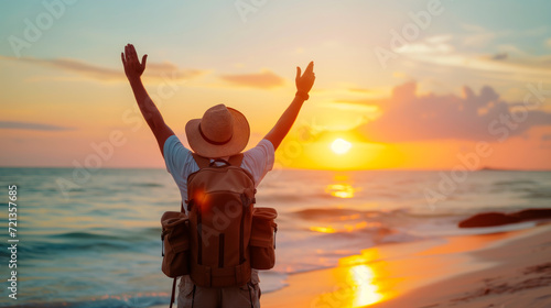 Wallpaper Mural Man with arms raised at tropical beach sunset, celebrating travel and exploration.
 Torontodigital.ca