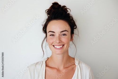portrait of a young smiling Australian woman in white background , Short Light effect