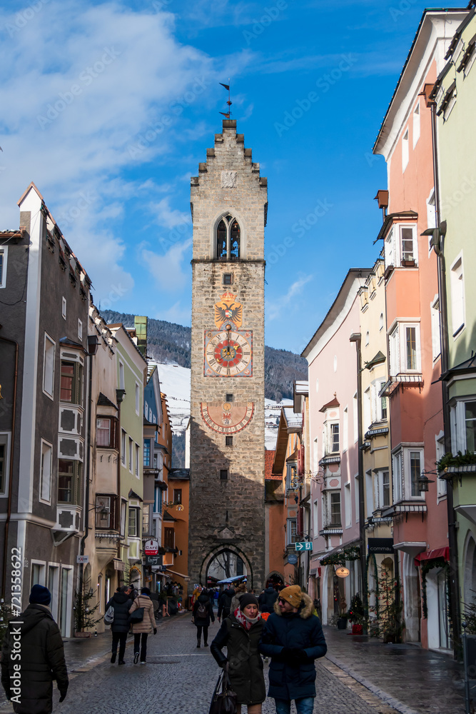 Fototapeta premium Vipiteno (Bolzano), Italy, 01.01.2024: view of the city center with the bell tower in the background.