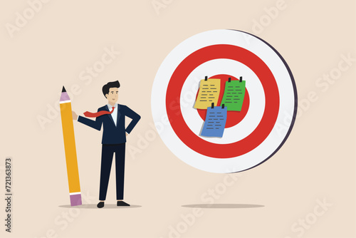 Goal setting, achievable target, mission to accomplish for business success concept, businessman write down goal on notes and put on big dartboard target.
