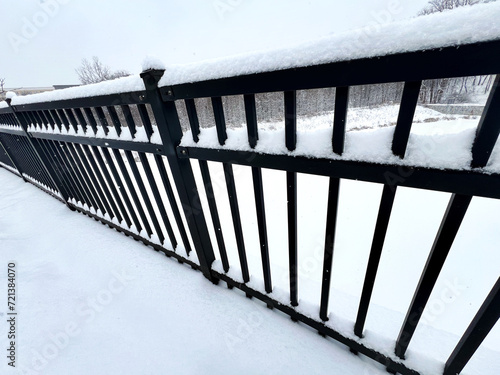 Snow covered railing