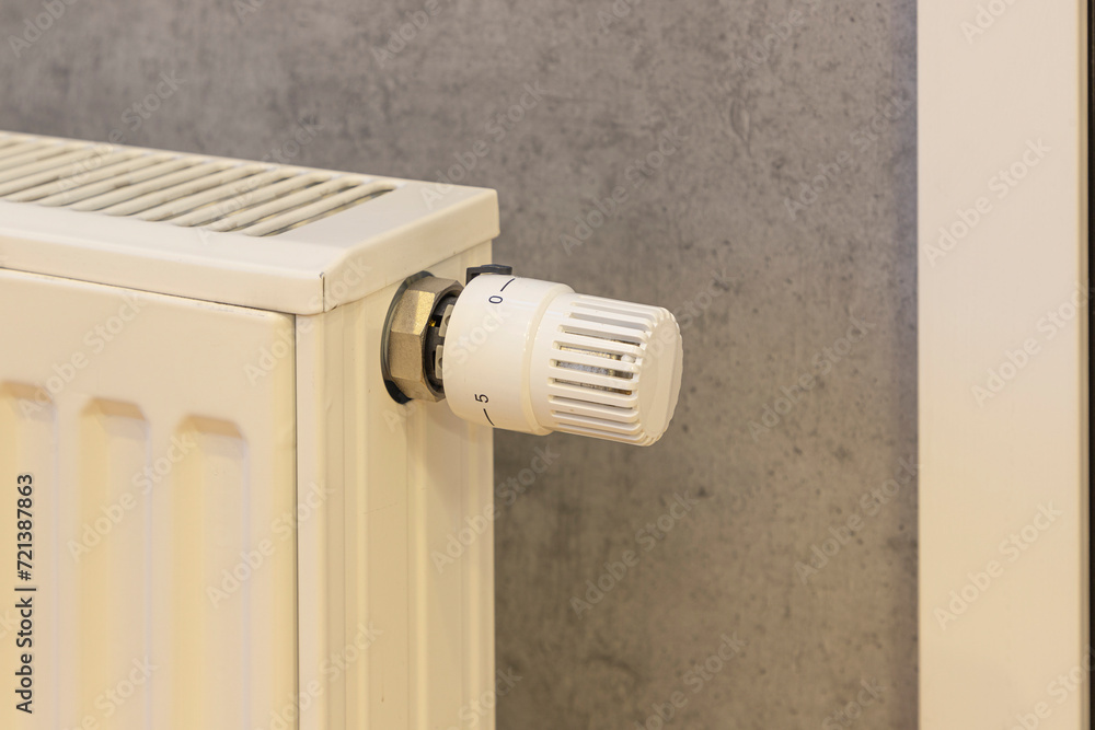 large sum of money in euros on a heating radiator. The concept of increasing prices for energy resources large sum of money in euros on a heating radiator. The concept of increasing prices for energy resources