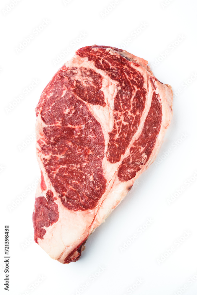 Beef steak. Ribeye steak raw meat on white isolated. Top view. Beef steak. Ribeye steak raw meat on white isolated. Top view.