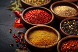 Assorted Spices in Wooden Bowls on Dark Background
