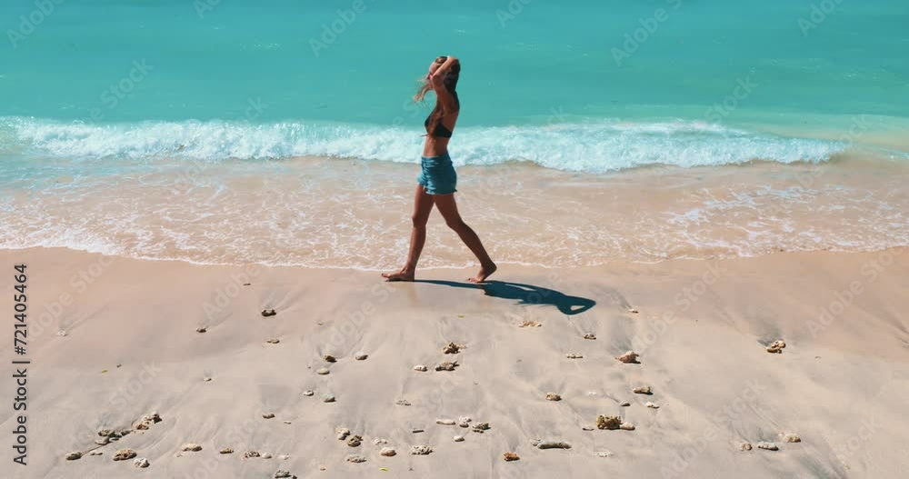 Woman on vacation relax on tropical sand beach. Tourist female walking barefoot seashore enjoying holidays on exotic Thailand island. Turquoise sea water background. Travel, tourism, active lifestyle Woman on vacation relax on tropical sand beach. Tourist female walking barefoot seashore enjoying holidays on exotic Thailand island. Turquoise sea water background. Travel, tourism, active lifestyle
