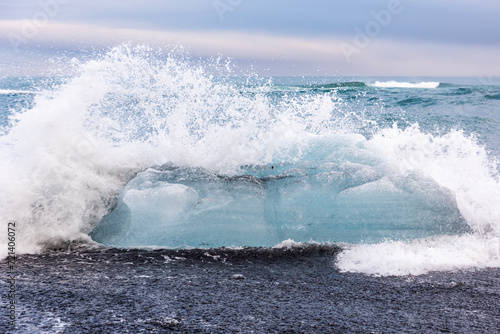 Wave breaking on the beach, diamond coast, the mystical landscape of Iceland photo