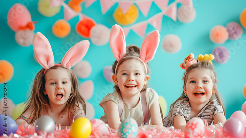 Happy girls in bunny ears celebrating easter