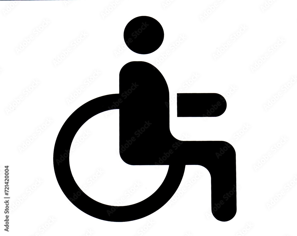 A road sign in the parking lot with the image of a person in a wheelchair. A place for the disabled. A road sign in the parking lot with the image of a person in a wheelchair. A place for the disabled.