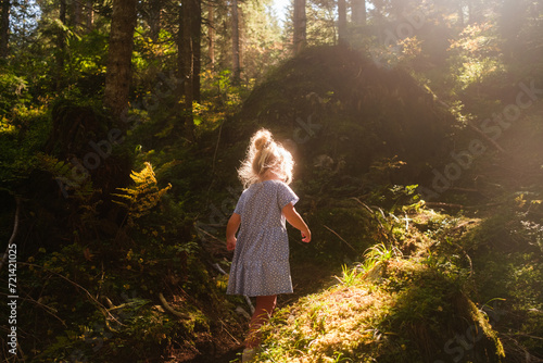 Young girl hiking in forest
