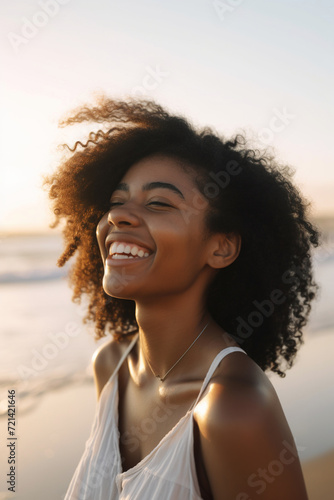 Portrait of a smiling woman on the beach © LeonPhoto