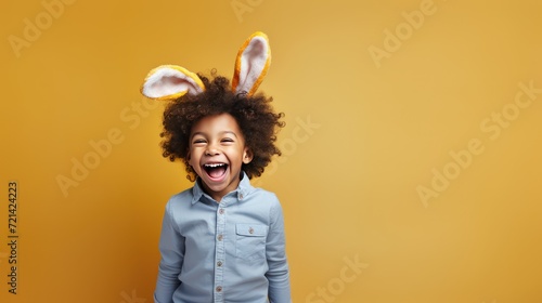 Spread joy with diversity! Our adorable African American boy, curly hair, and bunny ears share laughter while holding an Easter basket.