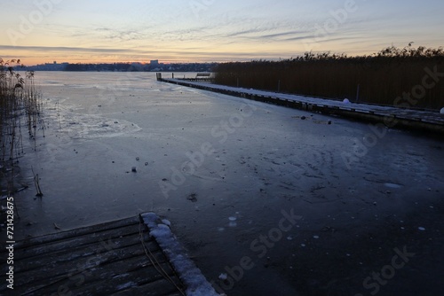 Sunset over frozen lake