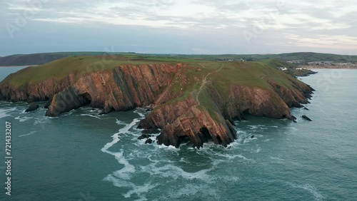 4k Epic Aerial View Of England's Coast, Baggy Point, North Devon photo