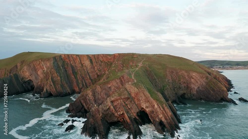 4k Epic Aerial View Of England's Coast, Baggy Point, North Devon photo