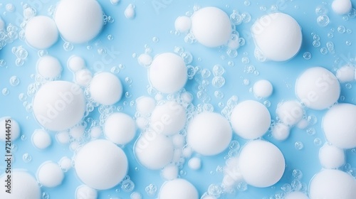 The bath foam is positioned on a blue background with shampoo bubbles. the texture of shampoo bubbles.
