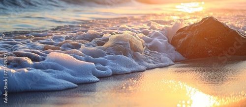 Serene Seashore: Captivating Early Morning at the Beach, Seaside Bliss in the Early Morning Sun, Mesmerizing Sea, Beach, and Early Morning Harmony photo