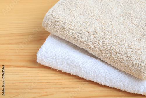 A two towels on wooden background, copy space.