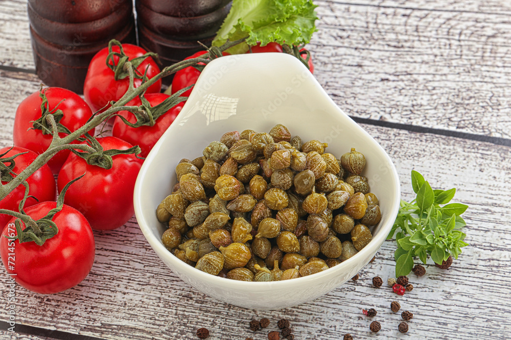 Marinated green capers in the bowl Marinated green capers in the bowl