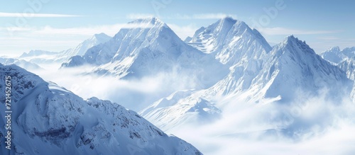 Captivating Winter Wonderland: Beautiful Snowy Mount Peaks on a Serene Winter Day © AkuAku