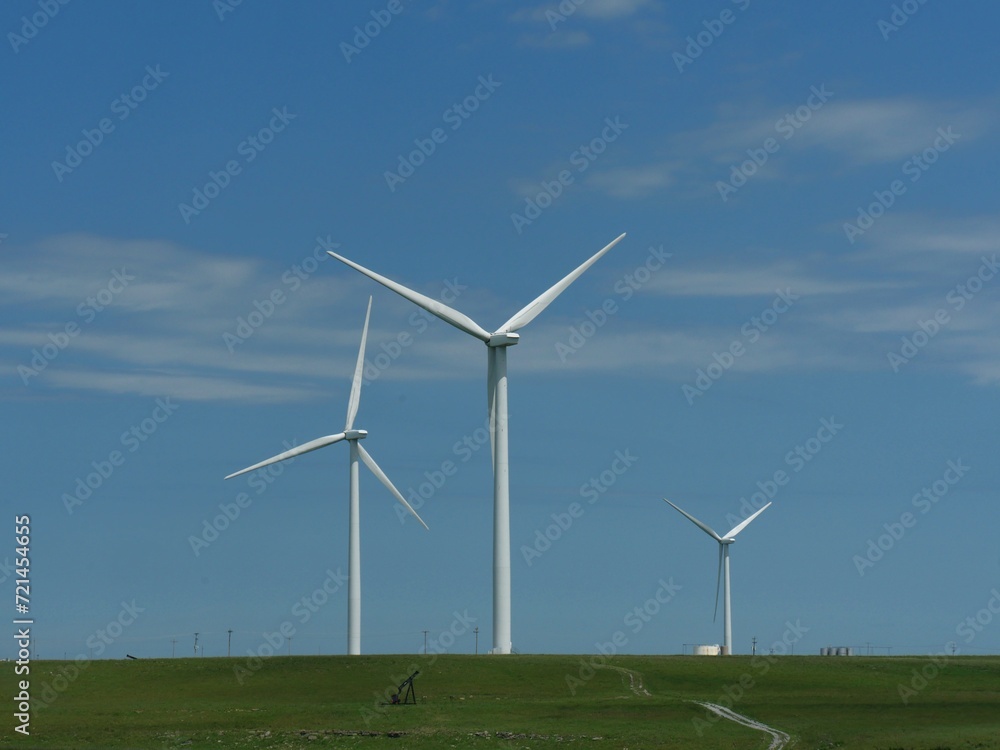 Windmills for electric power production, northern Oklahoma. Windmills for electric power production, northern Oklahoma.