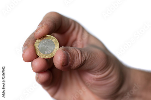 One Saudi Riyal Coin Hold by Man Hand, on White Background