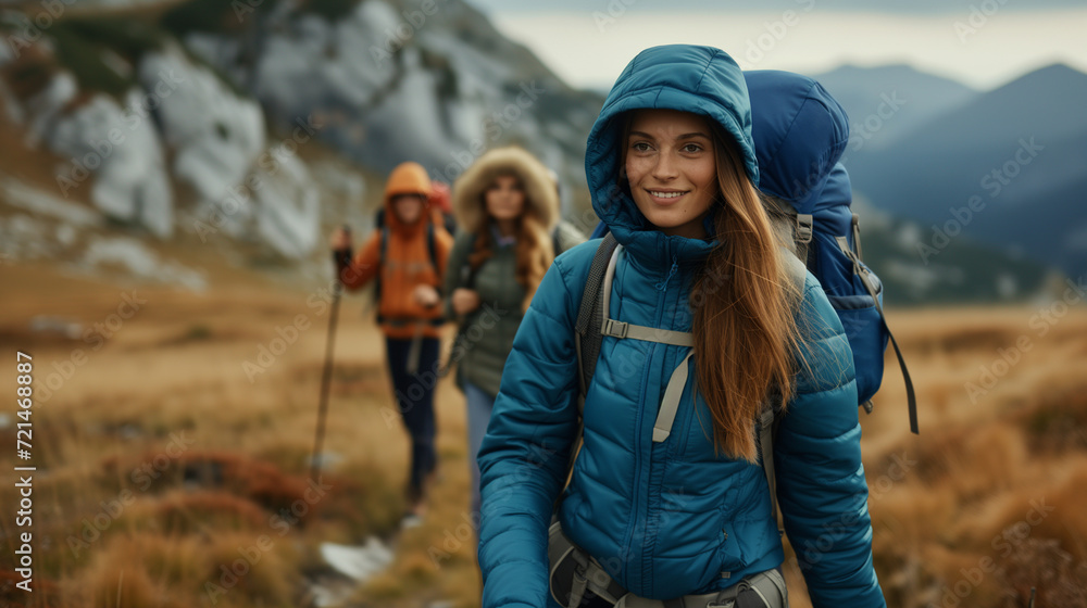 Young woman with backpack hiking in mountains. Young woman with backpack hiking in mountains.