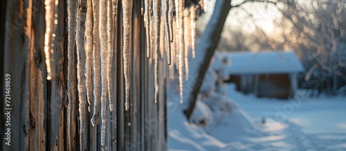 Dazzling Icicles Hanging Off the Side of a Shed  Creating a Stunning Winter Scene