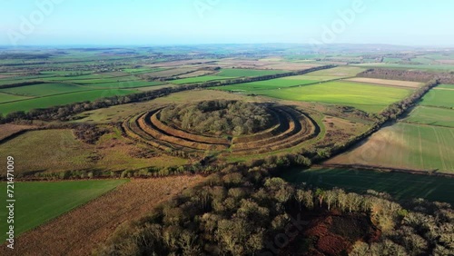 Wide circling aerial shot of Badbury rings, Iron age Hillforts, Dorset, UK photo