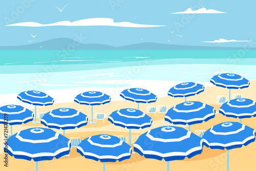 Parasols on beach in sunny summer day with blue sky