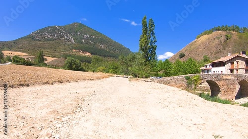 Roman bridge over Elorz river in Monreal (Elo) village, Navarra, Spain photo