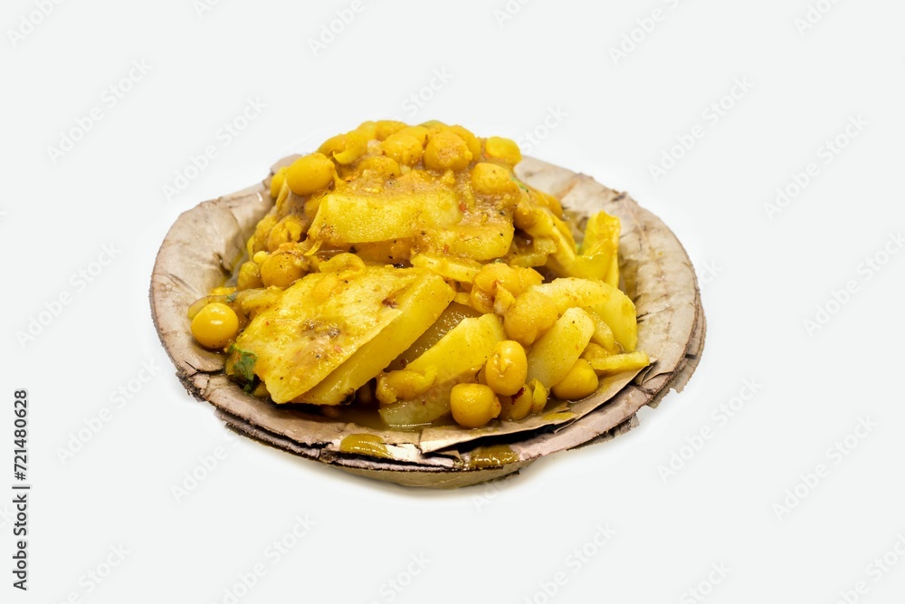 Alu Chat or Aloo Chaat Ghugni Garnished with Onion Cuts, Black Salt, Coriander in Disposable Bowl Isolated on White Background Alu Chat or Aloo Chaat Ghugni Garnished with Onion Cuts, Black Salt, Coriander in Disposable Bowl Isolated on White Background