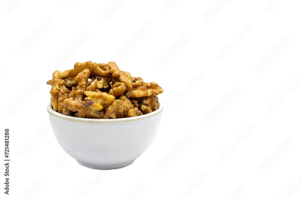 Walnut in a White Bowl Isolated on White Background with Copy Space in Horizontal Orientation Walnut in a White Bowl Isolated on White Background with Copy Space in Horizontal Orientation