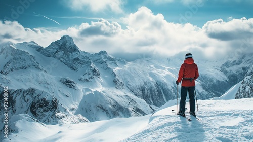 Man trekking in mountains. Cold weather, snow on hills